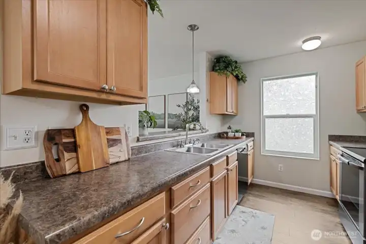 Light Filled with Plenty of Cabinets & nice counterspace.
