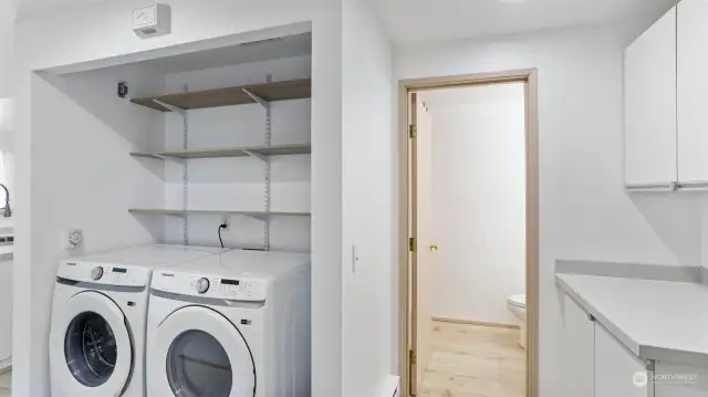 Laundry closet centrally located off the bedrooms and kitchen. Additional built-ins off the main bathroom perfect for linen storage.