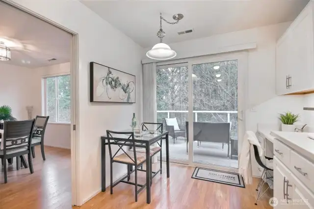 Nook and desk area with slider to patio. Room for patio furniture and pots.