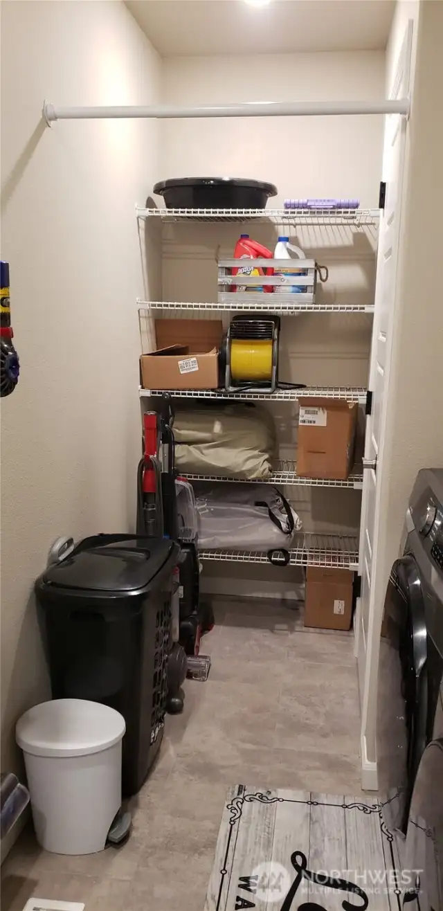 Another Picture of the Utility Room Showing 5 Storage Shelves