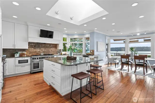 The chef’s kitchen is a masterpiece of design  and functionality. Equipped with high-end  appliances, custom cabinetry, and a spacious  island, it’s an ideal space for culinary  creativity and social gatherings.