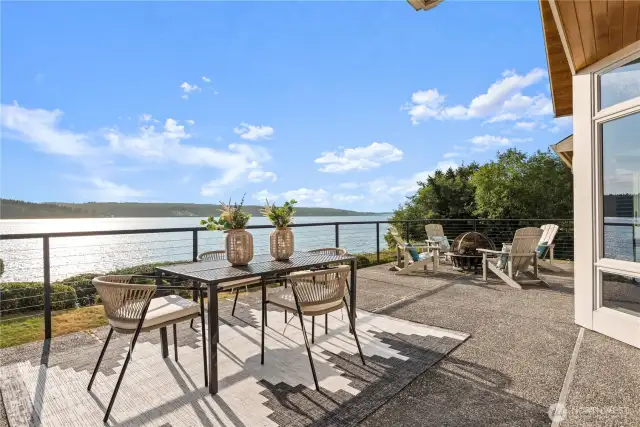 The deck’s design enhances the connection  between indoor and outdoor living, creating  a tranquil retreat with unobstructed, private  vistas of the water. It’s an ideal spot for al  fresco dining, sunset watching, or simply  unwinding in a picturesque environment.