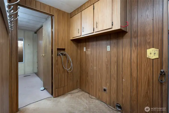 Laundry hookup in hall.