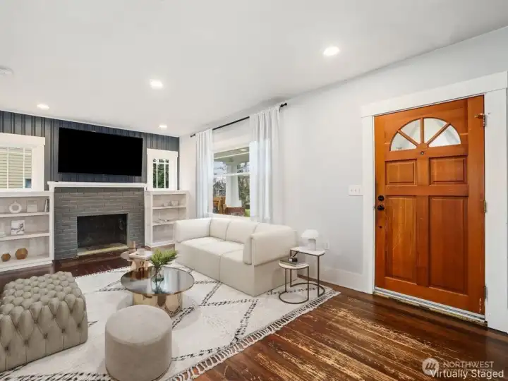 Living room with Fir floors  non working fireplace.