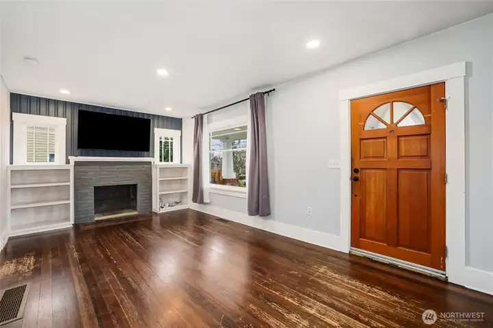 Living room with Fir floors  non working fireplace.