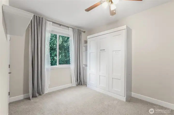 Desirable Main floor bedroom features private and peaceful wetland view.