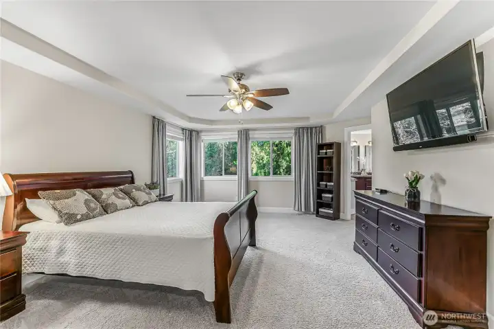 Sumptuous Primary Suite with tranquil view.