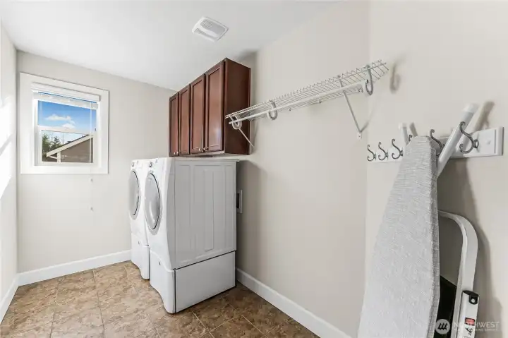 Convenient upstairs laundry room.