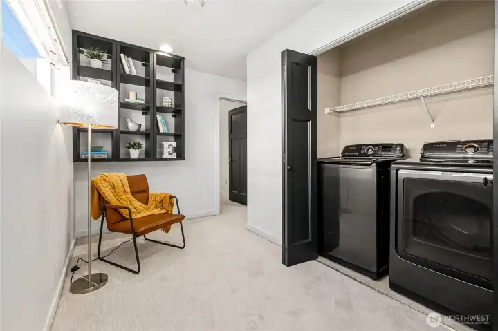 This area is at the top of  the stair landing. Laundry sits in the center between the bedrooms for max utility.