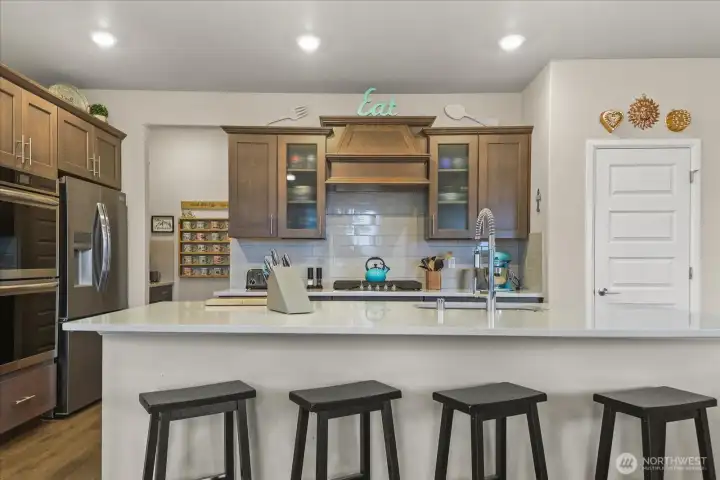 Ample bar seating at the island.