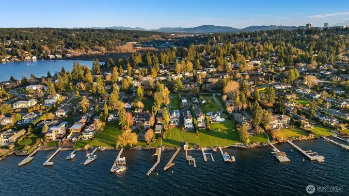 . Set on an expansive two-thirds of an acre lot with 62 feet of waterfront, this property offers front-row seats to golden sunsets over Lake Washington and the Olympic Mountains.