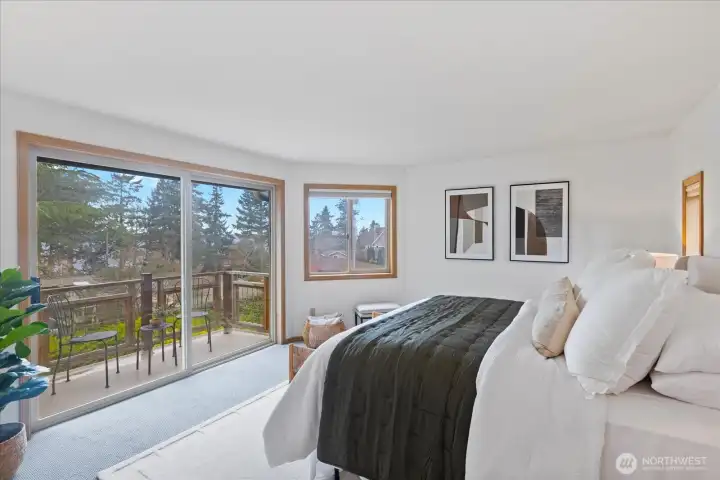 Primary bedroom has private balcony providing tons of natural light