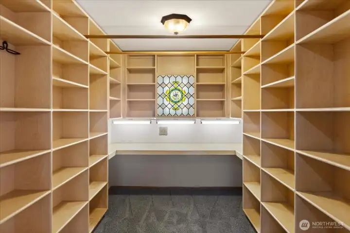 Walk in closet with built-ins and a desk