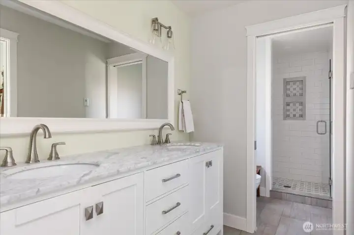 Main residence primary bath showing entrance to shower and toilet room.