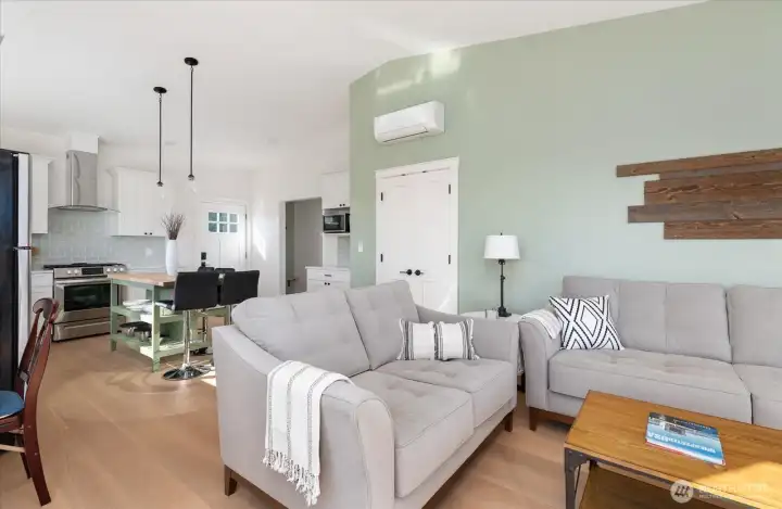 Guest Cottage looking from living area toward kitchen and bedroom, bath and laundry beyond.