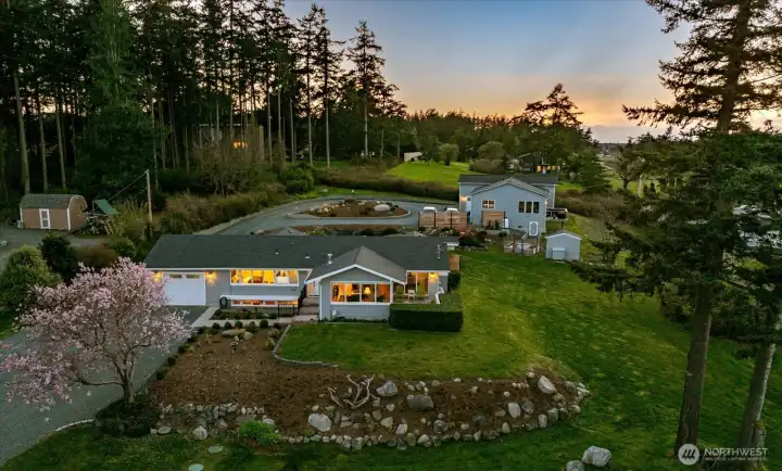 View of the primary residence and Guest Cottage behind at right.