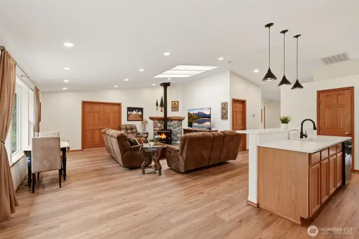Open Concept Living room and Kitchen with big windows and a sitting area for cozy mornings
