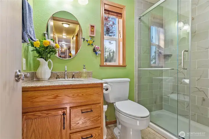 Meticulously renovated main bathroom featuring modern design, premium finishes, contemporary fixtures, elegant tiling, and a serene spa-like atmosphere.