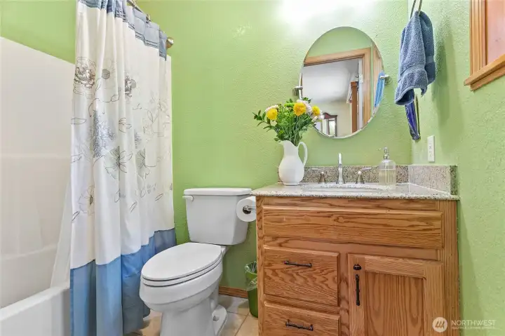 Primary bathroom featuring a soaking tub for a relaxing spa-like experience.