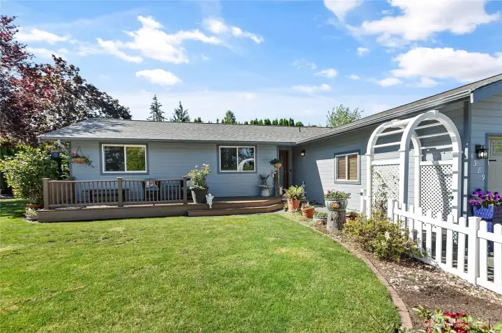 Beautifully landscaped walkway leading to the inviting front entrance.