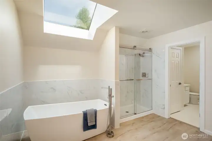 View of the soaking tub and oversized shower.   The toilet room is conveniently separate from the main part of the bathroom.