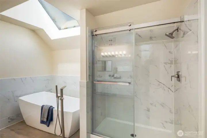 You'll love the beautiful new shower and soaking tub.  The shower features tiled walls and a convenient niche for shampoo, conditioner, and soap.