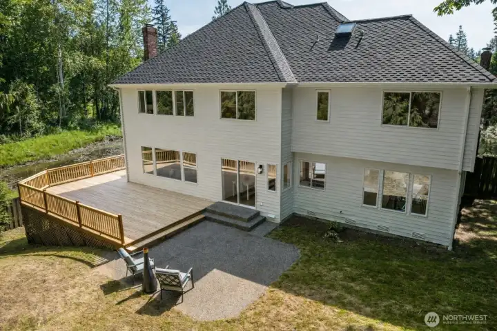 Nice view of the backyard patio and deck. Notice the duck pond just beyond the deck. Great place to observe nature! Nice view of the backyard patio and deck. Notice the duck pond just beyond the deck. Great place to observe nature!