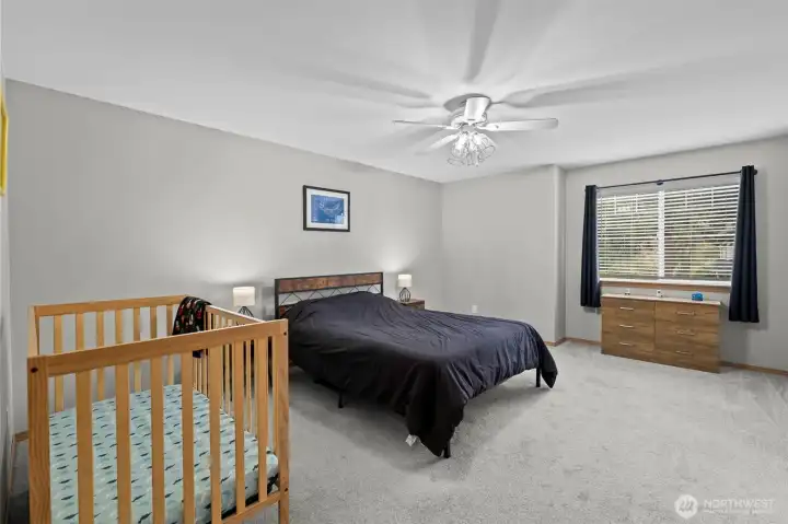 Primary suite with a private ensuite bath and walk-in closet.