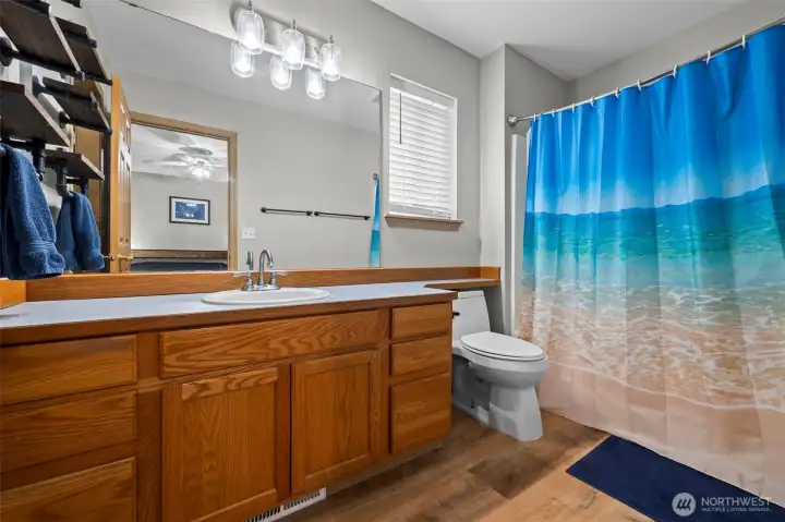 Primary suite with a private ensuite bath and walk-in closet.