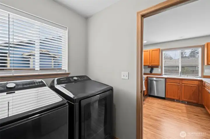 Laundry lead w/storage and off the garage on the main floor