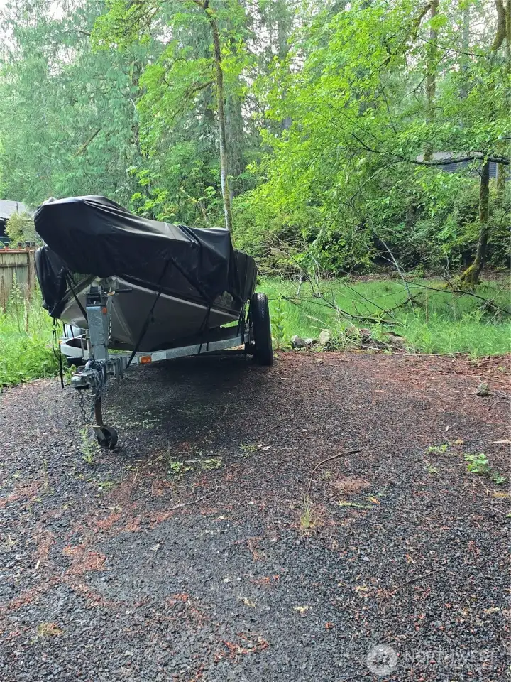 Neighbors boat currently parked on property. Neighbors boat currently parked on property.