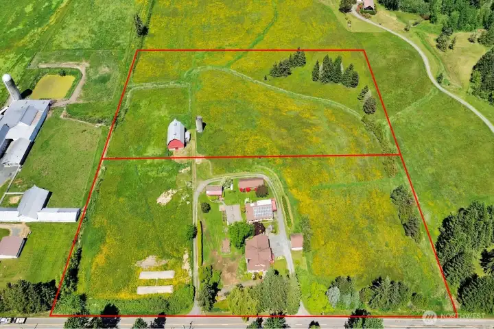 Back 5 acres has it's own parcel # and is included is sale.