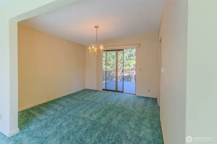Oak floors underneath dining area.