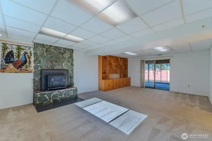 Sliding glass door accesses enclosed patio.