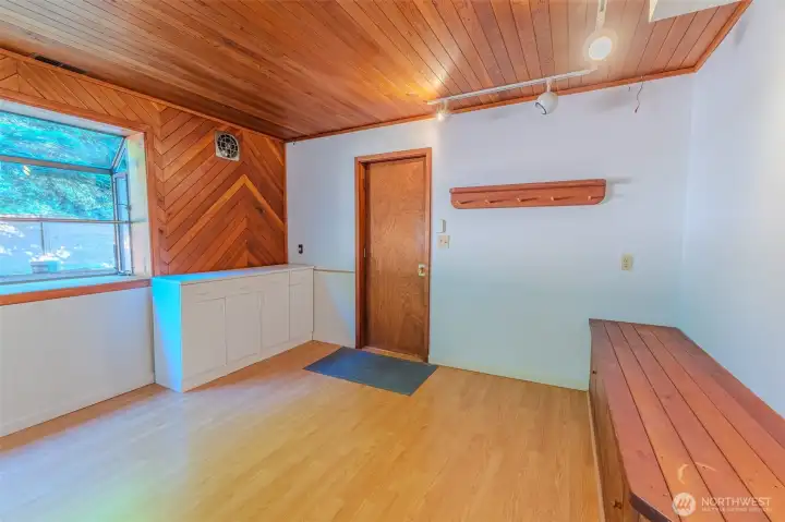 Craft room, office area or flex space. Door accesses the garage.