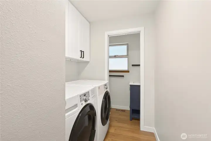 Laundry and half bath located off the kitchen