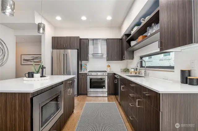 Beautiful stainless appliances, ample light and storage
