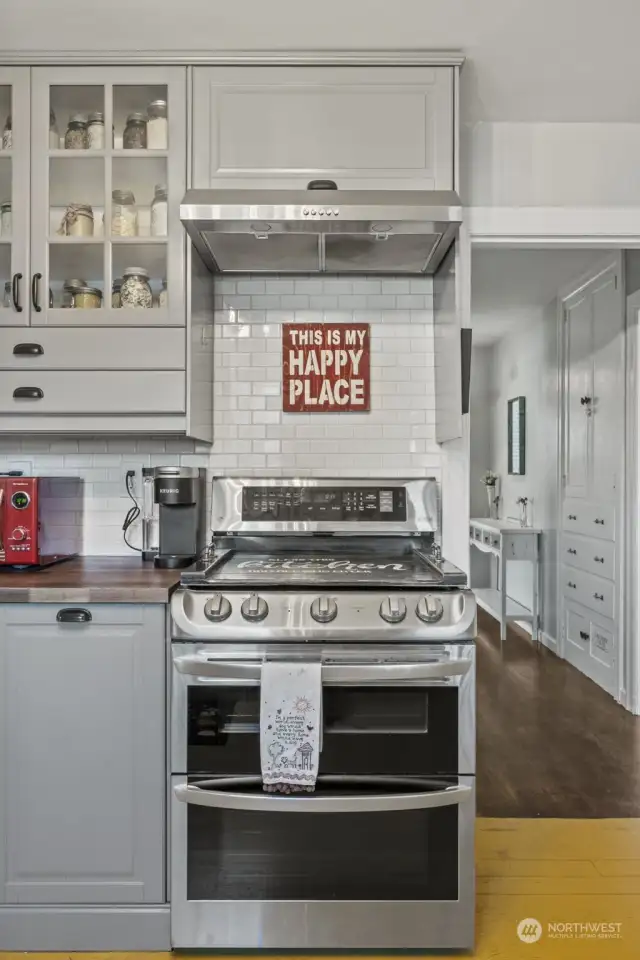 The view of the stove and Kitchen hood.