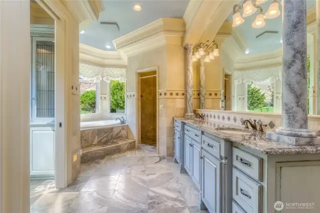 Primary suite bathroom with tile heated floors and double vanity