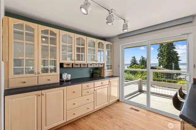 Bonus kitchen space offers flexibility—use it as a bar or a stylish gateway to the stunning deck and views.