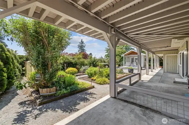 Enjoy the seamless flow from patio to charming studio and lush garden—an outdoor retreat awaits.