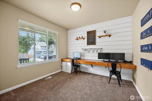 Upon entry, a very large office/den is on your left.