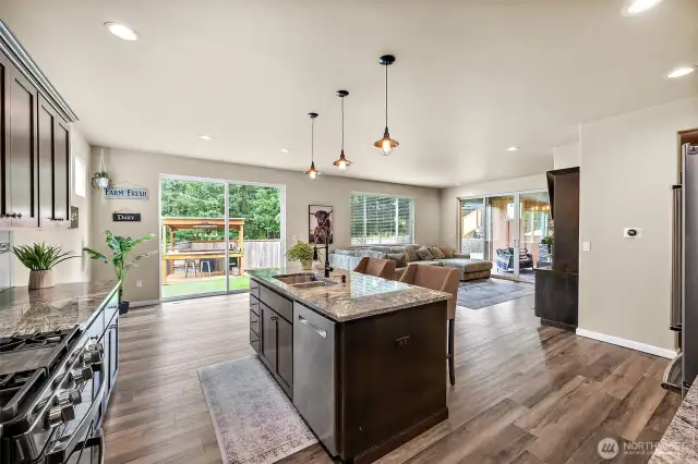 open concept living downstairs with two oversized, massive sliding doors
