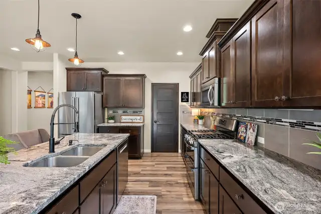 open concept living downstairs with two oversized, massive sliding doors