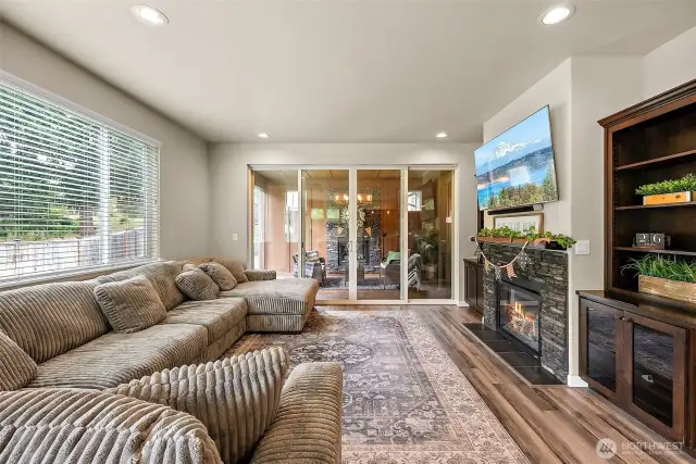 open concept living downstairs with two oversized, massive sliding doors