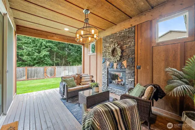 Massive slider opens to a Covered and 3/4 framed in back deck with outdoor fireplace and wired for a tv!