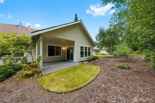Enjoy the serenity of a private back patio that backs up to the Forest Lands, offering peaceful views and added privacy.