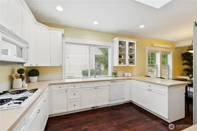 Abundant cabinetry provides plenty of space for storage, keeping your kitchen organized and clutter-free.