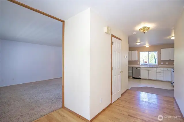 Hallway to Living Room Kitchen with 1/2 Bath on left.