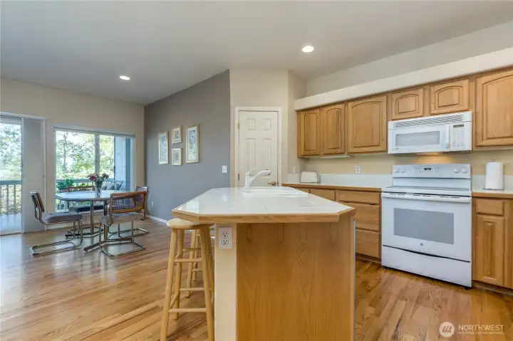Generous kitchen connects to informal dining and family rooms